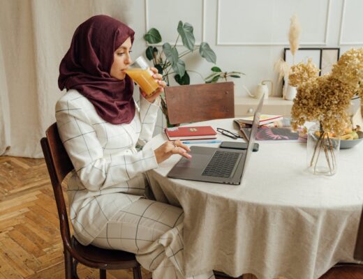 woman in a hijab using a laptop