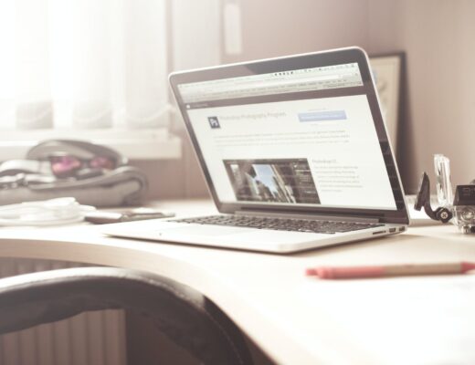 black and gray laptop computer on writing desk